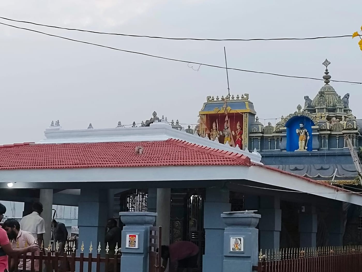 The Venkatapuram Ramalayam — a village temple with a red-tiled roof and gopuram towers bearing images of Sri Rama, Sita, Lakshmana and Hanuman.